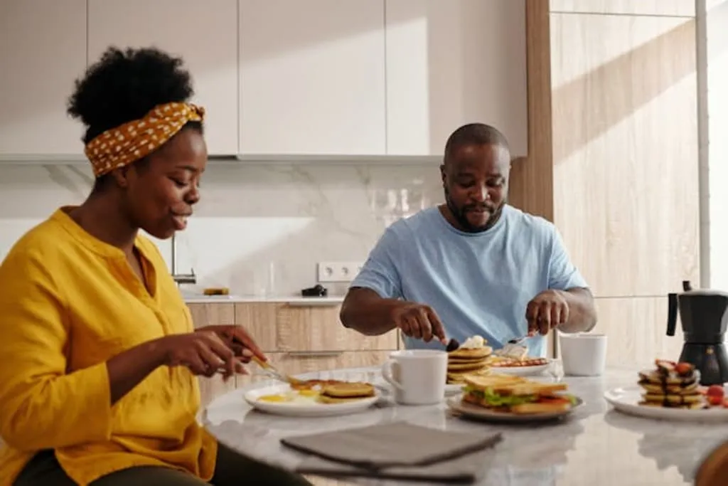 Metal desk lamp halo against dusk-colored wall